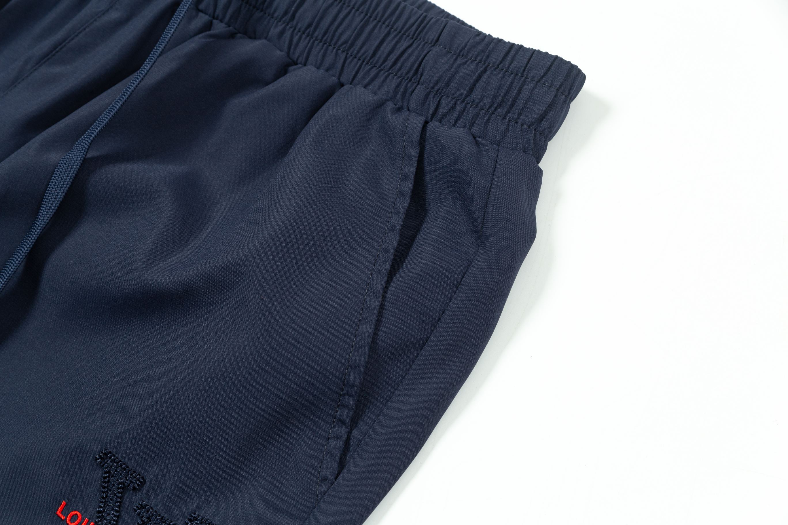 Embroidered nylon beach shorts