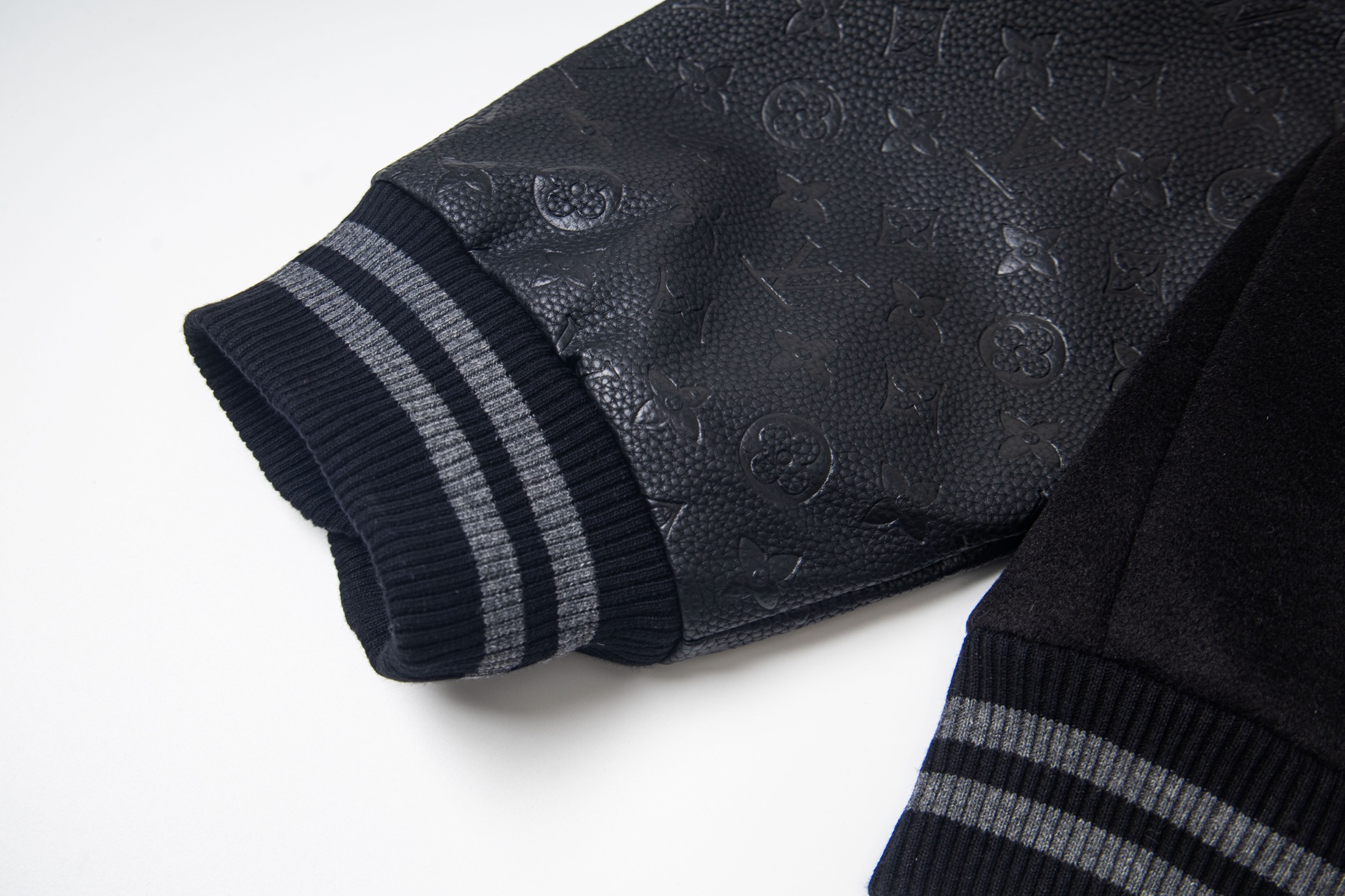 leather-paneled baseball jacket