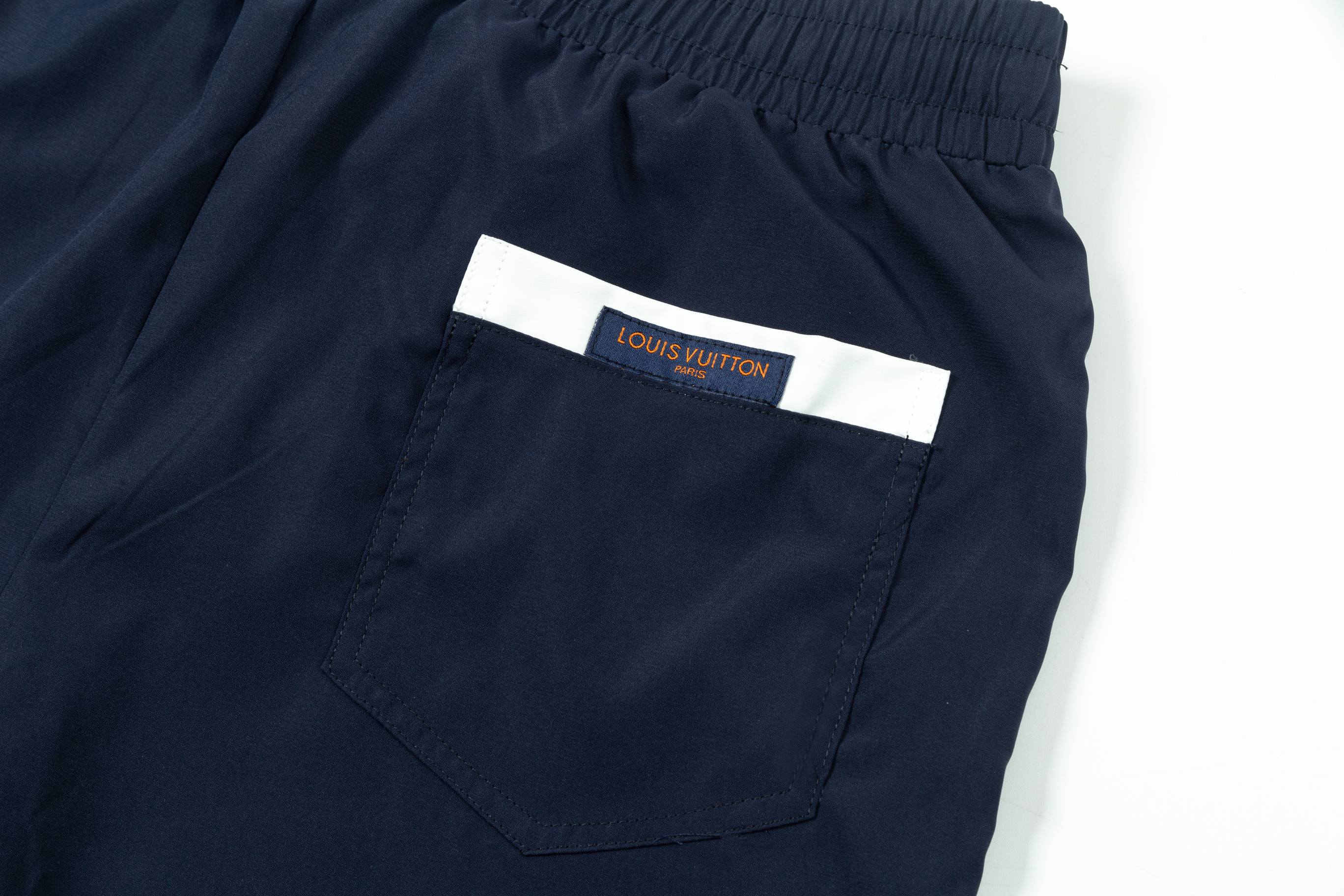 Embroidered nylon beach shorts